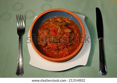 Bowl with typical cuban food - meet in tomato sauce