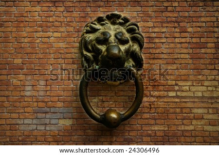 Abstract background with bricks and vintage metal lion head