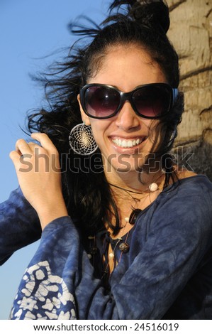 Portrait of young beautiful hispanic fashion model smiling