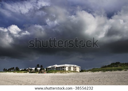 A view of seaside building under tropical storm clouds