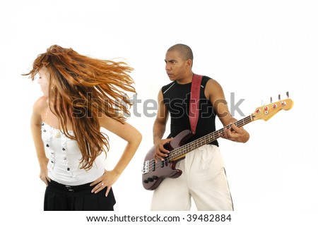 Portrait of young multiracial couple of young man playing bass guitar and girl dancing isolated