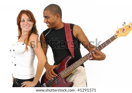 Portrait of young multiracial couple of man playing bass guitar and girl isolated on white