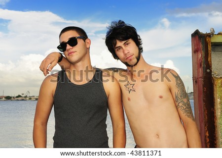 Portrait of young trendy hispanic guys posing with attitude