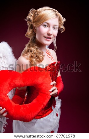 stock photo Perfect blonde angel with a red heart