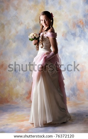 Beautiful woman dressed as a bride over colored background.