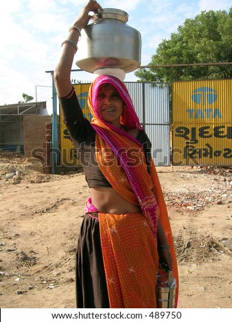 An Indian Village Women carrying a vessel on her head