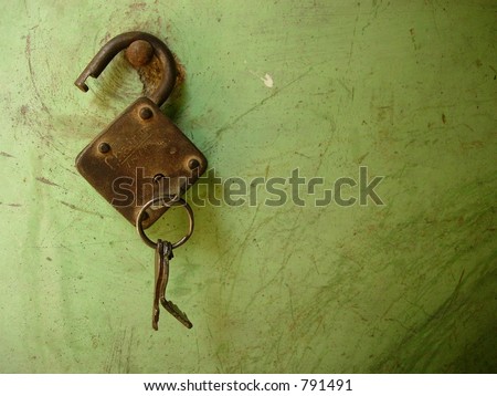 open lock and keys hanging