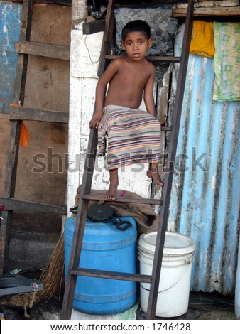 editorial: a poor boy in a slum in mumbai india
