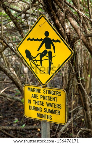 Jellyfish warning sign in Queensland Australia stating: marine stingers are present in these waters during summer months