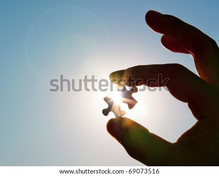 stock photo : Pinch a piece of the jigsaw puzzle