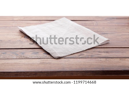 Wooden deck table with tablecloth isolated on white. Kitchen background, product montage display. Mock up.