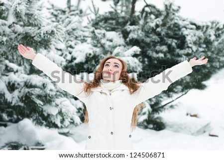 Christmas Girl.Winter woman Blowing Snow  Positive concept of freedom