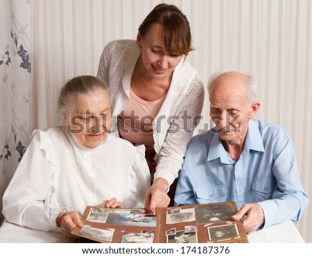 Senior Man, Woman With Their Caregiver At Home. Concept Of Health Care For Elderly Old People, Disabled