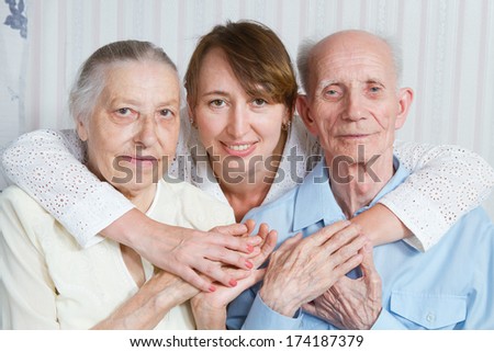 Senior Man, Woman with their Caregiver at Home. Concept of Health Care for Elderly Old People, Disabled