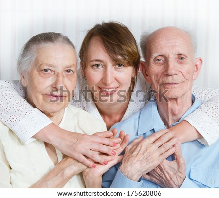 Senior Man, Woman with their Caregiver at Home. Concept of Health Care for Elderly Old People, Disabled