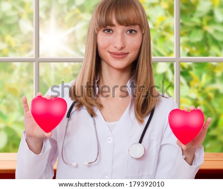 Health insurance or love concept. Doctor holding heart. Concept of medicine, health care, diagnostics.