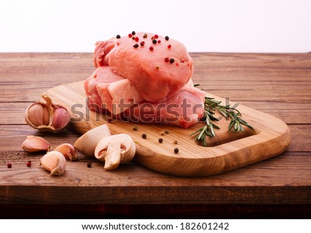 Raw meat for barbecue with fresh vegetables wooden surface. Food, meat raw steak, beef steak bbq, spices for cooking meat