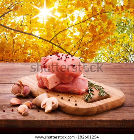 Raw meat for barbecue with fresh vegetables wooden surface. Food, meat raw steak, beef steak bbq, spices for cooking meat