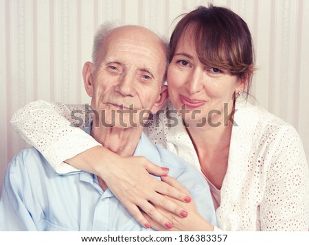 Senior Man, Woman with their Caregiver at Home. Concept of Health Care for Elderly Old People, Disabled. Elderly man, woman.