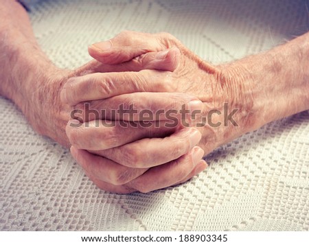 Care is at home of elderly. Old people holding hands. Closeup. Elderly man.