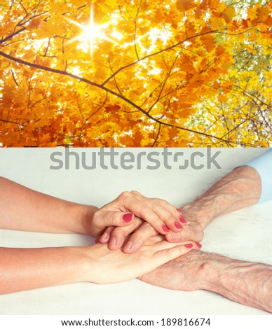 Senior and young holding hands outside. Care is at home of elderly. Space for text. Senior man, woman with their caregiver. Concept of health care for elderly old people, disabled. Elderly man.