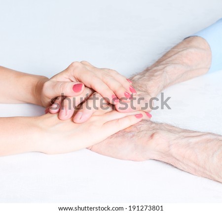 Senior and young holding hands outside. Care is at home of elderly. Space for text. Senior man, woman with their caregiver. Concept of health care for elderly old people, disabled. Elderly man.