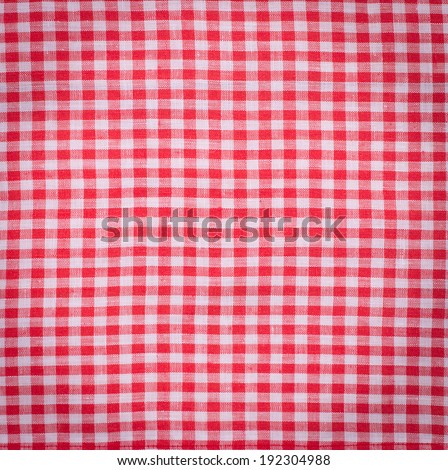 Canvas texture or background. Red checked tablecloth view from top. Empty tablecloth for product montage. Free space for your text