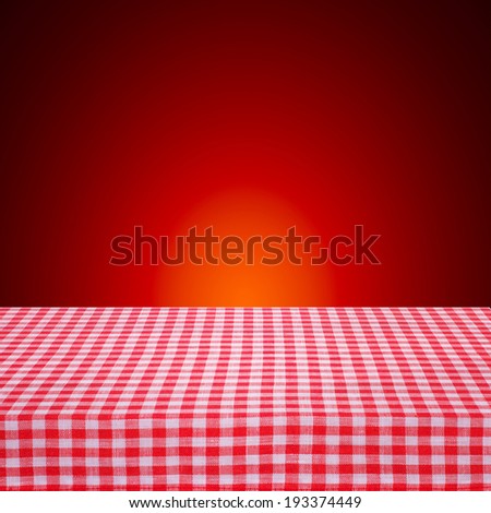 Canvas texture or background on the table. Red checked tablecloth view from top. Empty tablecloth for product montage. Free space for your text