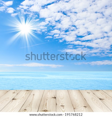 Wood texture background. Blue sea and clouds on sky. beach and tropical sea. Empty wooden deck table with tablecloth for product montage. Sunny day, blue sky with clouds. Free space for your text