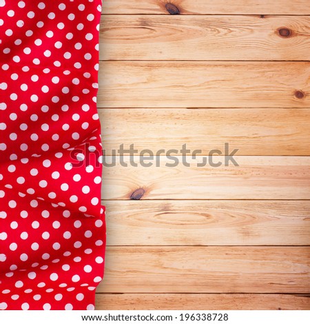 Wood texture background. Pure notebook for recording menu, recipe on red checkered tablecloth tartan. Wooden table close up view from top