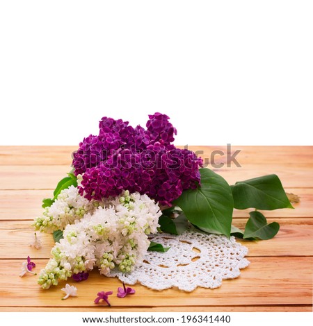 Wood texture background. Flower lilac branch. White and purple lilac. Beautiful bouquet of colorful spring flowers. Template for greeting cards, mother\'s day, valentine, birthday celebration.
