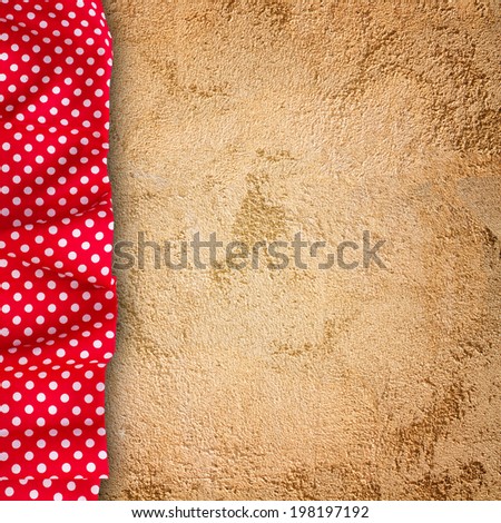 Stone texture, background. Unusual stone wall texture with cloth. Red tablecloth white peas for recording menu, recipe. Product pages for installation recipe books menu