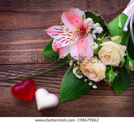 Flowering branch with white delicate flowers on wooden surface. Declaration of love, spring. Wedding card, Valentine's Day greeting. Wedding bouquet, background. Empty wooden tabletop Space for text
