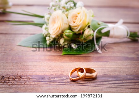 Wedding card, Valentine's Day greeting. Wedding bouquet, background. Flowering branch with white delicate flowers on wooden surface. Declaration of love, spring.  Empty wooden tabletop Space for text
