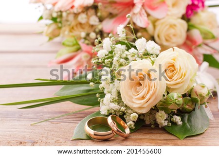 Flowering branch with white delicate flowers on wooden surface. Declaration of love, spring. Wedding card, Valentine\'s Day greeting. Wedding bouquet, background. Empty wooden tabletop Space for text