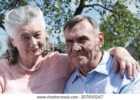 Happy and smiling senior couple in love. Happy couple portrait, closeup. Elderly couple walking. Mature couple walking in garden. 60s woman, man.