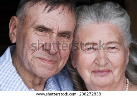Happy and smiling senior couple in love. Happy couple portrait, closeup. Elderly couple walking. Mature couple walking in garden