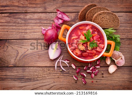 Ukrainian and Russian national Red Borscht on wooden surface, menu cooking recipes. Food, spices for cooking.