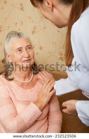 Doctor explaining diagnosis to his female patient. Concept of health care for elderly old people, disabled.