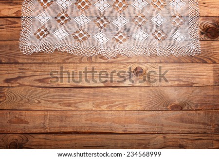 Wood texture, wooden table with white lace tablecloth top view. Collage for menu