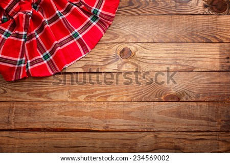 Wood texture, wooden table with red tablecloth tartan top view. Collage for menu