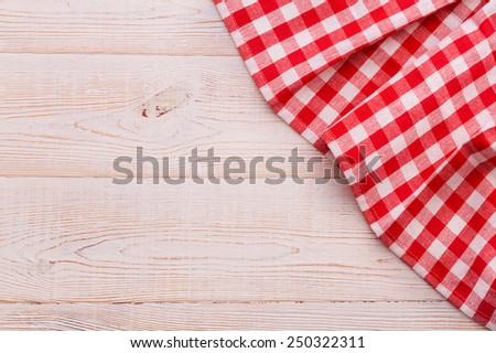 Wooden table covered with tablecloth. View from top texture wallpaper horizontal. Unique perspectives. Empty tablecloth for product montage. Free space for products and for your text
