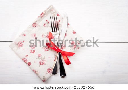Empty cutlery on table cloth on wooden table for dinner. Top view horizontally.