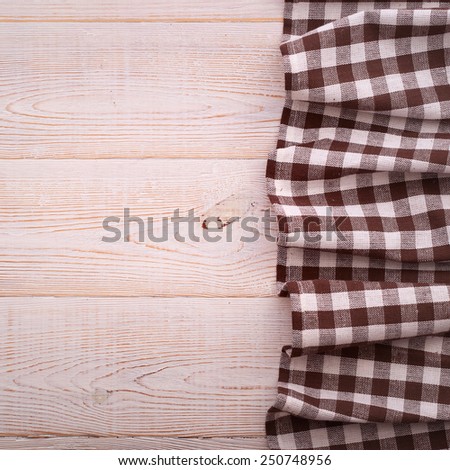 Wooden table covered with tablecloth. View from top texture wallpaper square. Unique perspectives. Empty tablecloth for product montage. Free space for products and for your text