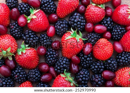 Berries, summer fruit on wooden table. Healthy lifestyle concept, Top view horizontal, Selective focus
