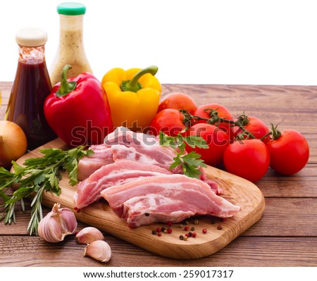 Food. Sliced pieces of raw meat for barbecue with fresh vegetables. Meat raw steak. Beef steak bbq.