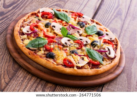 Delicious fresh pizza with seafood. Seafood Italian Pizza slice on wood table horizontal