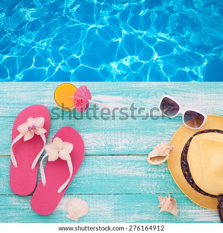 Summer concept of sandy beach, straw hat, shells and starfish. Flat design. Top view beach accessories mock up for design