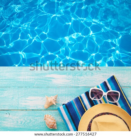 Summer vacation. Pink sandals by swimming pool. Blue sea surface with waves, texture water. Flat mock up for design.