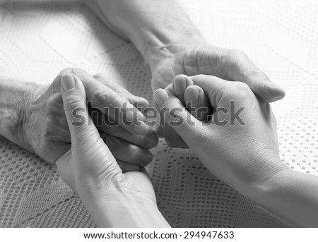 Elderly man. Senior man, woman with their caregiver at home. Concept of health care for elderly old people, disabled. Black and white.